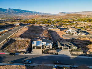 Birds eye view of property with a mountain view