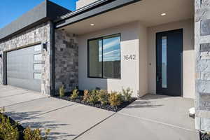 Entrance to property featuring a garage