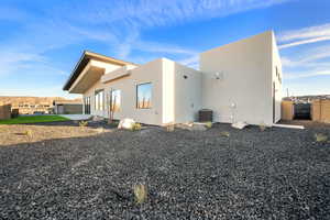 View of home's exterior featuring a patio and central AC unit