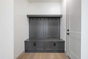 Mudroom with light hardwood / wood-style flooring