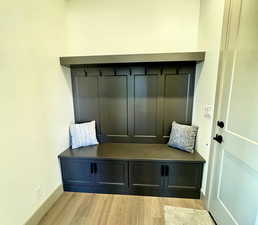 Mudroom with light hardwood / wood-style floors