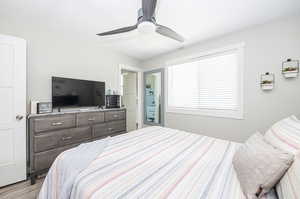 Bedroom featuring light hardwood / wood-style flooring and ceiling fan