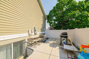 View of patio featuring central AC and grilling area