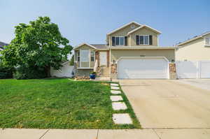 Tri-level home with a front yard