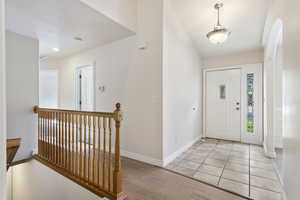 Foyer with light hardwood / wood-style floors