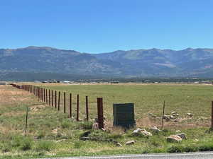 Property view of mountains with a rural view