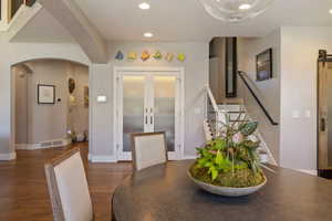 Open Semi Formal dining area w/ hardwood flooring, recessed lighting & frosted glass paneled dinette closet.