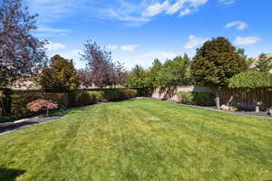 View of private & secluded backyard w/ matured landscaping & valley views.