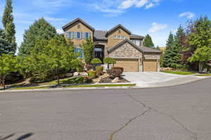 Exterior front facade of house w/ 3-Car Garage & matured landscaped yard.