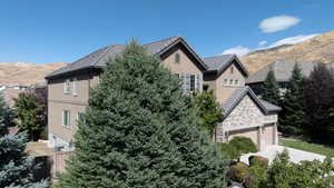 Exterior space featuring a mountain view and a garage