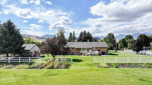 View of yard with a mountain view and a rural view