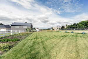 View of yard with a rural view