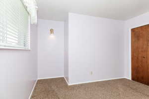 Empty room featuring carpet floors