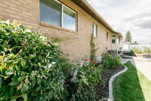 View of side of home featuring central AC unit