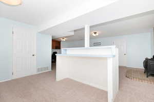 Family room with a gas stove and dry bar.