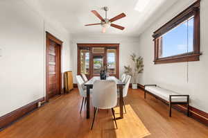 Dining space featuring light wood-type flooring and ceiling fan