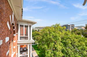 View of yard featuring a balcony