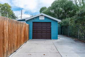 Garage featuring wooden walls