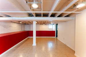 Basement featuring tile patterned flooring