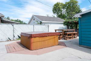 View of patio featuring a hot tub