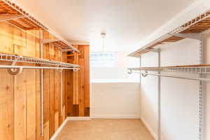 Spacious closet featuring tile patterned flooring