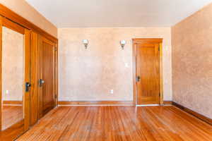 Unfurnished room with light wood-type flooring