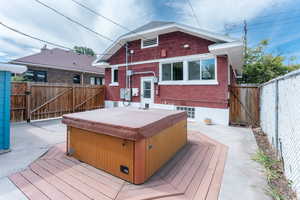 Wooden terrace with a hot tub