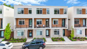 View of front of house with a balcony