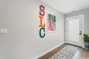 Foyer entrance with hardwood / wood-style flooring