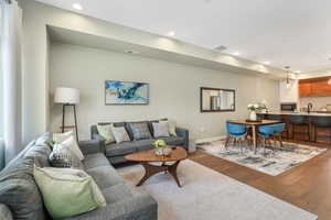 Living room with sink and light hardwood / wood-style floors