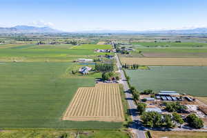 Birds eye view of property featuring a mountain view and a rural view