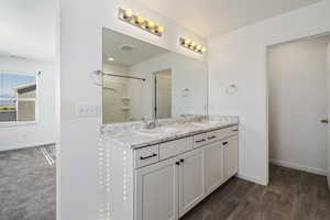 Bathroom with walk in shower, wood-type flooring, a textured ceiling, and vanity