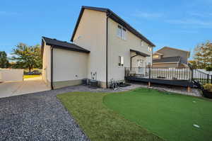 Rear view of house featuring a deck and RV parking