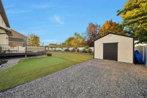 Exterior space with putting green and shed