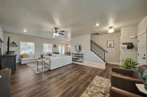 View of entryway, living room and staircase