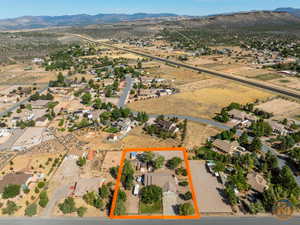 Birds eye view of property with a mountain view