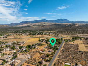 Birds eye view of property with a mountain view