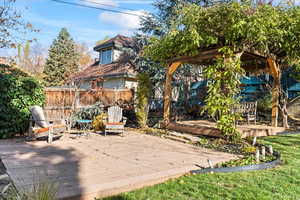 View of patio featuring a wooden deck