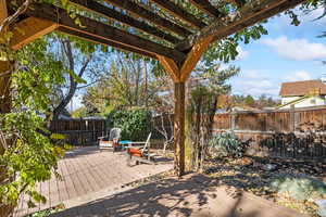 View of patio featuring a pergola and a deck