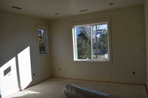 Unfurnished bedroom featuring multiple windows