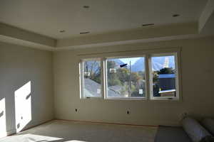 Interior space featuring a raised ceiling