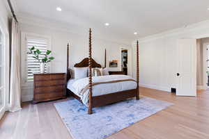 Bedroom featuring crown molding and white oak floors