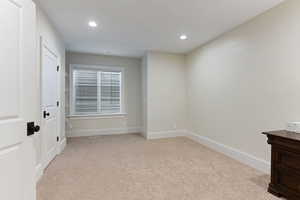 Bedroom with light carpet