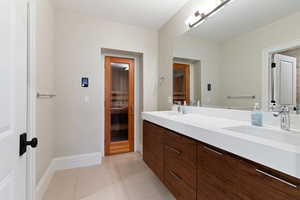 Bathroom featuring vanity and tile patterned floors