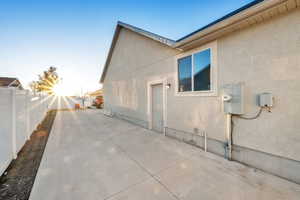 View of side of property with a patio area