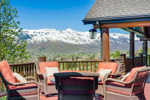 Wooden deck featuring outdoor lounge area and a mountain view