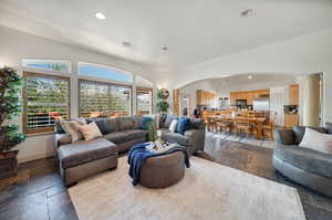 Living room featuring vaulted ceiling