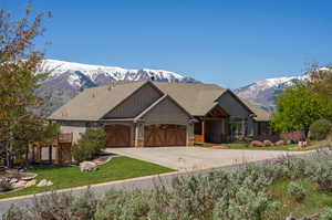 Craftsman-style home with a mountain view and a garage