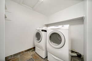 Clothes washing area featuring independent washer and dryer