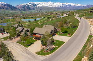 Aerial view featuring a water and mountain view